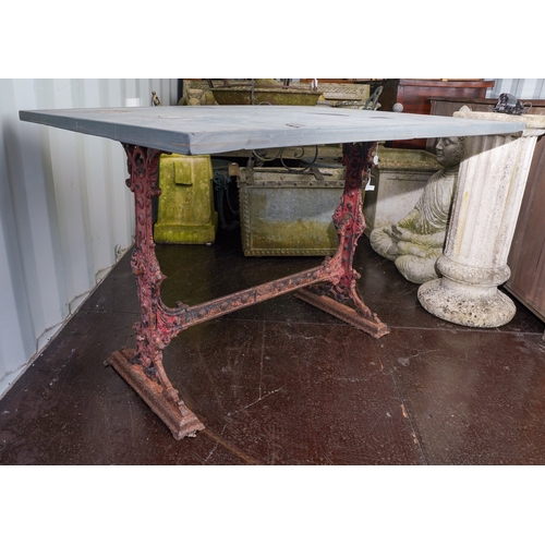 471 - A Victorian cast iron trestle table with rectangular slate top, the base cast with scrolls and raise... 