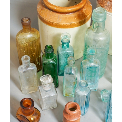 474 - Collection of antique glass bottles and 2 stone ware jars ( 1 box)