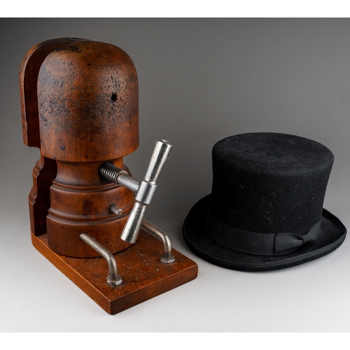 477 - Antique wooden hat stretcher together with a modern woollen top hat (2)