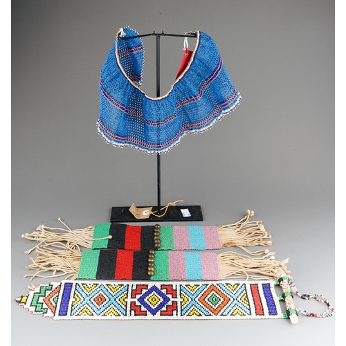 495 - Ethnographica - two tribal pairs of vintage Zulu beaded anklets with display stand