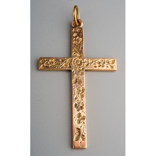 753 - 9 ct gold crucifix with etched foliot detail to front, gross weight 8g, measures 5.2cm x 3cm