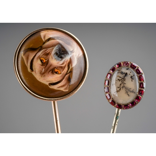 762 - Two antique stickpins. To include an early 20th century miniature portrait of a dog, together with a... 