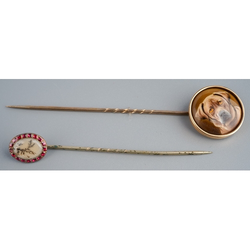 762 - Two antique stickpins. To include an early 20th century miniature portrait of a dog, together with a... 