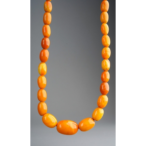 763 - A set of amber butterscotch beads, total length 26.5g, gross weight 20g