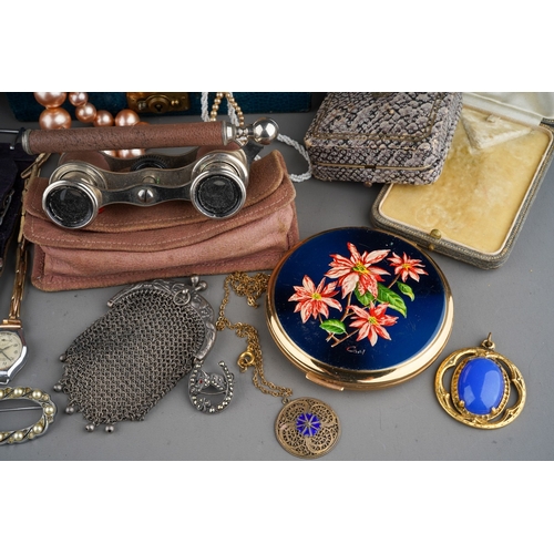 765 - A mixed lot of Costume jewellery to include: brooches, tie pins, cufflinks, beads, faux pearls, bead... 