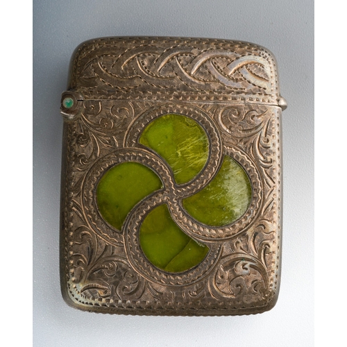 863 - An Edwardian silver and agate vesta case, the front profusely engraved with Celtic knot and swirling... 