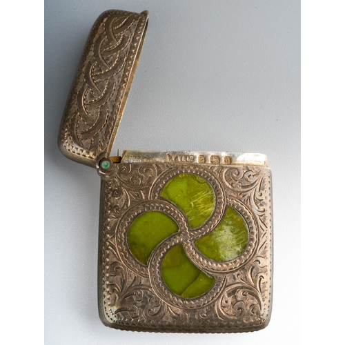 863 - An Edwardian silver and agate vesta case, the front profusely engraved with Celtic knot and swirling... 