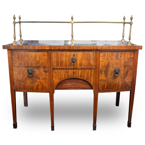 882 - An early 19th century mahogany and satinwood strung sideboard, brass rail back with five urn finials... 