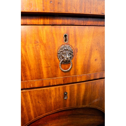 882 - An early 19th century mahogany and satinwood strung sideboard, brass rail back with five urn finials... 