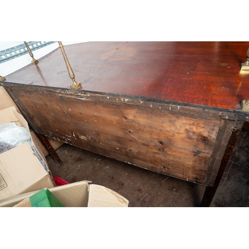 882 - An early 19th century mahogany and satinwood strung sideboard, brass rail back with five urn finials... 