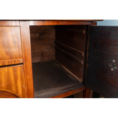 882 - An early 19th century mahogany and satinwood strung sideboard, brass rail back with five urn finials... 