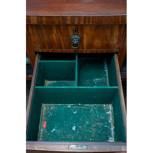 882 - An early 19th century mahogany and satinwood strung sideboard, brass rail back with five urn finials... 