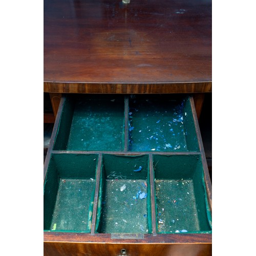 882 - An early 19th century mahogany and satinwood strung sideboard, brass rail back with five urn finials... 