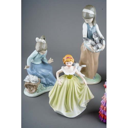 883 - A collection of seven ceramic figures to include: 
1. Lladro 1309 - Girl with Cat and Kittens
2. Lla... 