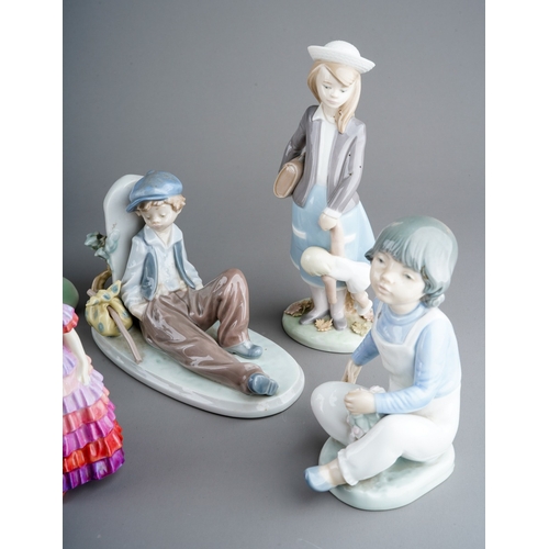 883 - A collection of seven ceramic figures to include: 
1. Lladro 1309 - Girl with Cat and Kittens
2. Lla... 