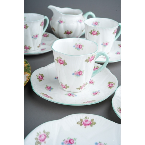 885 - A Shelley part Rosebud 13426 coffee service to include: five coffee cans, six saucers, a milk jug an... 