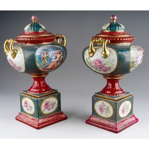 886 - A pair of early 20th Century Continental Vienna style pedestal two handled urns and covers, painted ... 