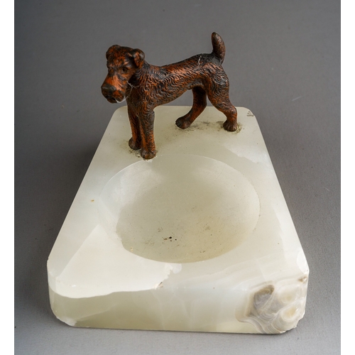 900 - A 20th Century novelty ashtray mounted with a bronzed metal model of a Fox Terrier