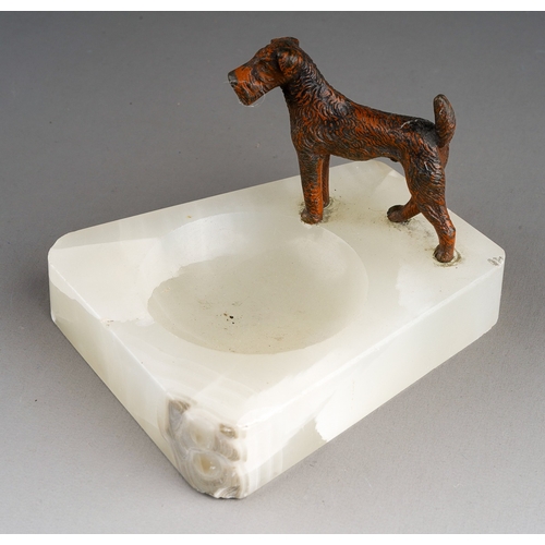 900 - A 20th Century novelty ashtray mounted with a bronzed metal model of a Fox Terrier