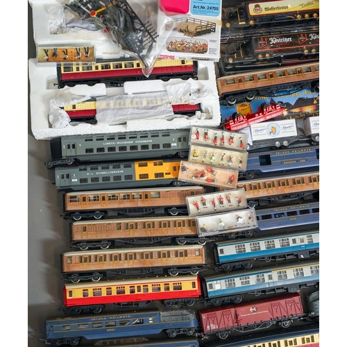 1104 - Assorted loose model railway rolling stock, carriages and locomotives together with diorama coal yar... 