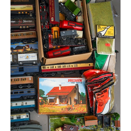 1104 - Assorted loose model railway rolling stock, carriages and locomotives together with diorama coal yar... 