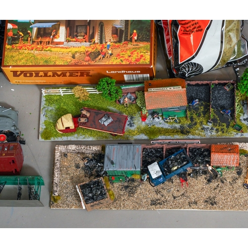 1104 - Assorted loose model railway rolling stock, carriages and locomotives together with diorama coal yar... 