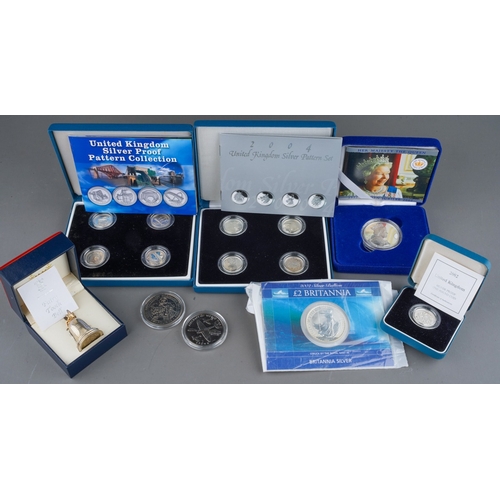 1114 - Queen Elizabeth II British silver  and other coins, etc, comprising a sealed Royal Mint 2002 £2 coin... 