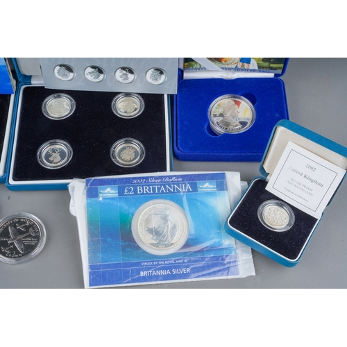 1114 - Queen Elizabeth II British silver  and other coins, etc, comprising a sealed Royal Mint 2002 £2 coin... 