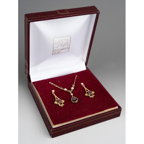 1127 - 9 ct gold set of earrings and matching necklace set with red gem stones and seed pearls, in their or... 