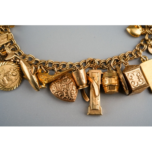 1133 - 9 ct gold charm bracelet together with loose charms, gross weight 58g