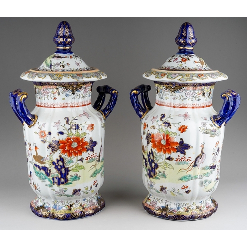 9 - A pair of 19th century Masons Ironstone twin handled jars and covers, the domed covers with octagona... 