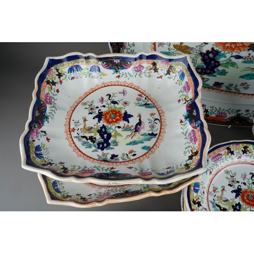 24 - A Mason`s Patent Ironstone China part Imari dinner service,  the central section with exotic birds a... 