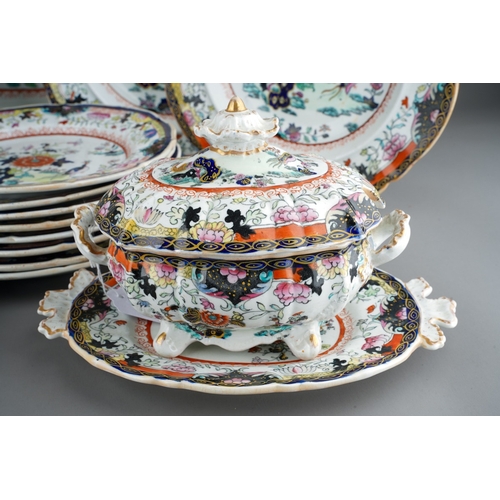 24 - A Mason`s Patent Ironstone China part Imari dinner service,  the central section with exotic birds a... 