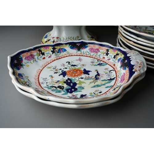 24 - A Mason`s Patent Ironstone China part Imari dinner service,  the central section with exotic birds a... 