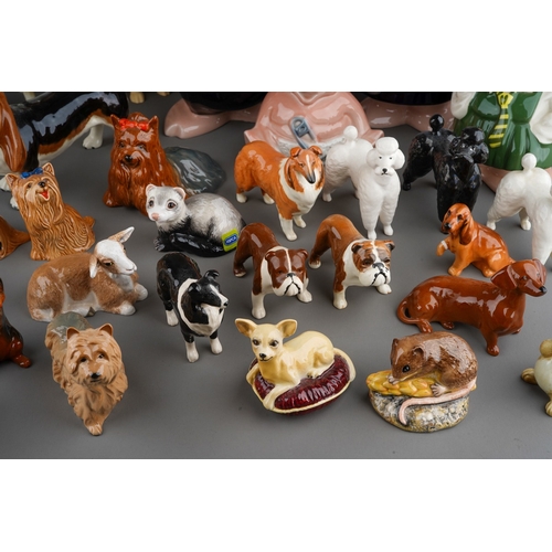 31 - Two boxes of various porcelain animals including Beswick dogs ad other animals together with 5 Wade ... 