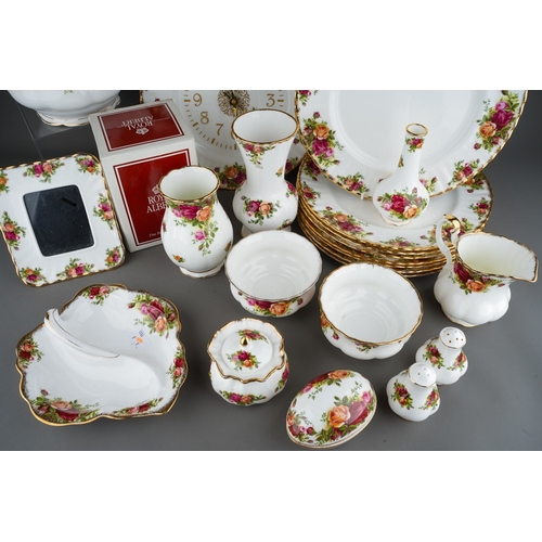 33 - Collection of Royal Albert Country Roses pattern tea wares, dinner wares etc to include large tea po... 