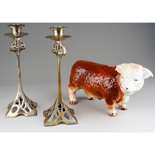 38 - A pair of Art Nouveau EPNS candlesticks in the manner of WMF with openwork stands, detachable scones... 