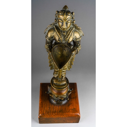 65 - Antique Hindu Bronze Deepa Lakshmi Oil lamp, wooden base, overall height including the base approx. ... 