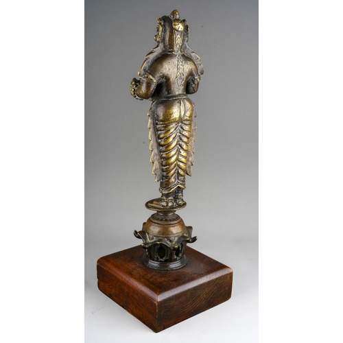 65 - Antique Hindu Bronze Deepa Lakshmi Oil lamp, wooden base, overall height including the base approx. ... 