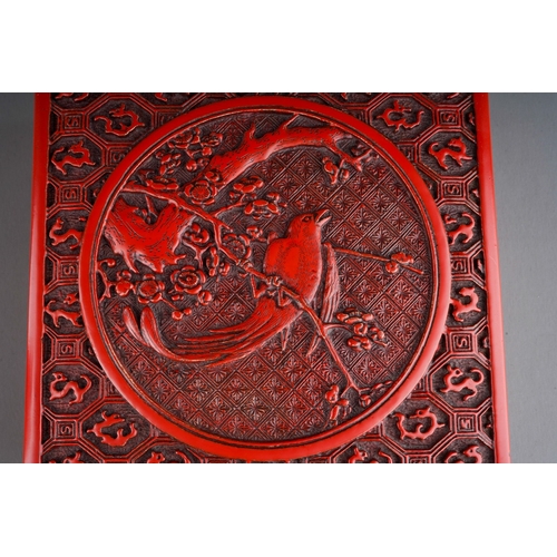 68 - A Chinese cinnabar lacquer square box, the cover carved with bird, flowers and dragons, approx. 17 c... 