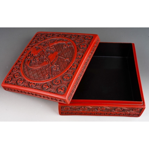 68 - A Chinese cinnabar lacquer square box, the cover carved with bird, flowers and dragons, approx. 17 c... 