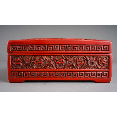 68 - A Chinese cinnabar lacquer square box, the cover carved with bird, flowers and dragons, approx. 17 c... 