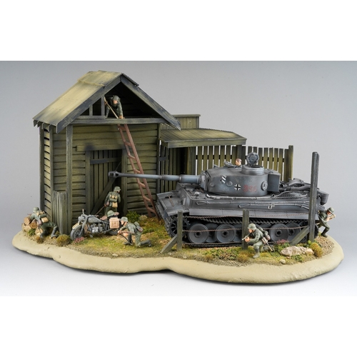 409 - A 21st century scale model World War II diorama of German troops with panzer tank by a barn with tro... 