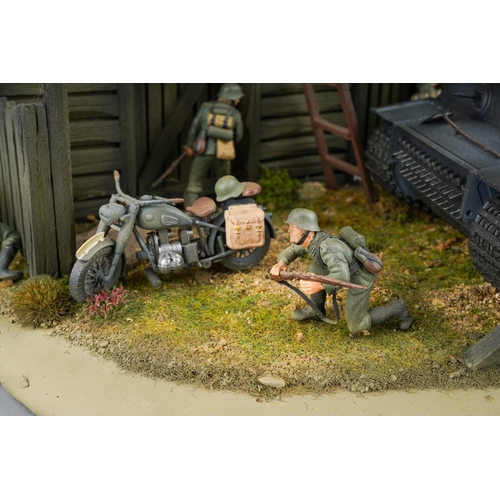 409 - A 21st century scale model World War II diorama of German troops with panzer tank by a barn with tro... 