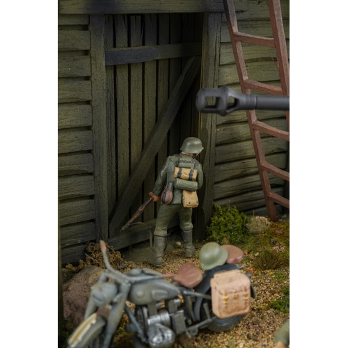 409 - A 21st century scale model World War II diorama of German troops with panzer tank by a barn with tro... 