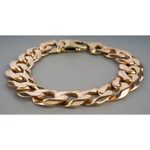 529 - A gentleman's modern curb link bracelet, stamped to one link with sponsors mark and 375, etc, length... 