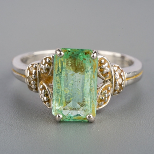 536 - An 18ct white gold dress ring, set with a pale green gem stone, possibly tourmaline, UK ring size P,... 