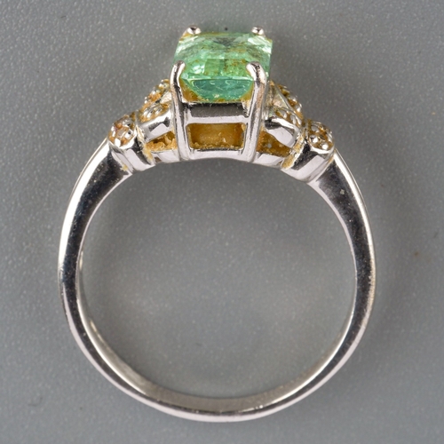 536 - An 18ct white gold dress ring, set with a pale green gem stone, possibly tourmaline, UK ring size P,... 