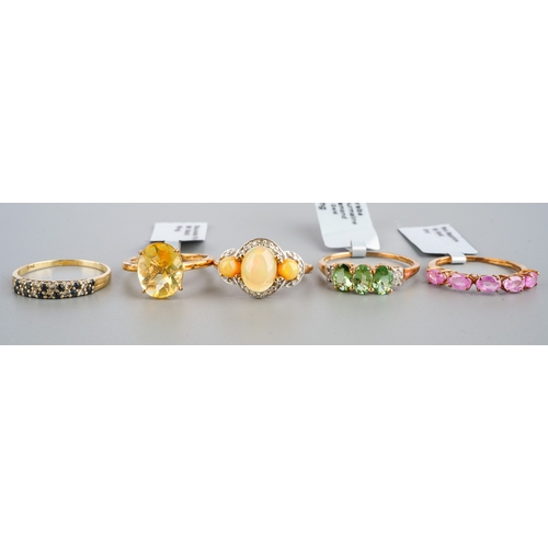 538 - Five modern 9ct gem set dress rings, three with shop labels attached, including a Dourada fire opal,... 