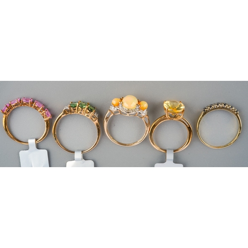 538 - Five modern 9ct gem set dress rings, three with shop labels attached, including a Dourada fire opal,... 